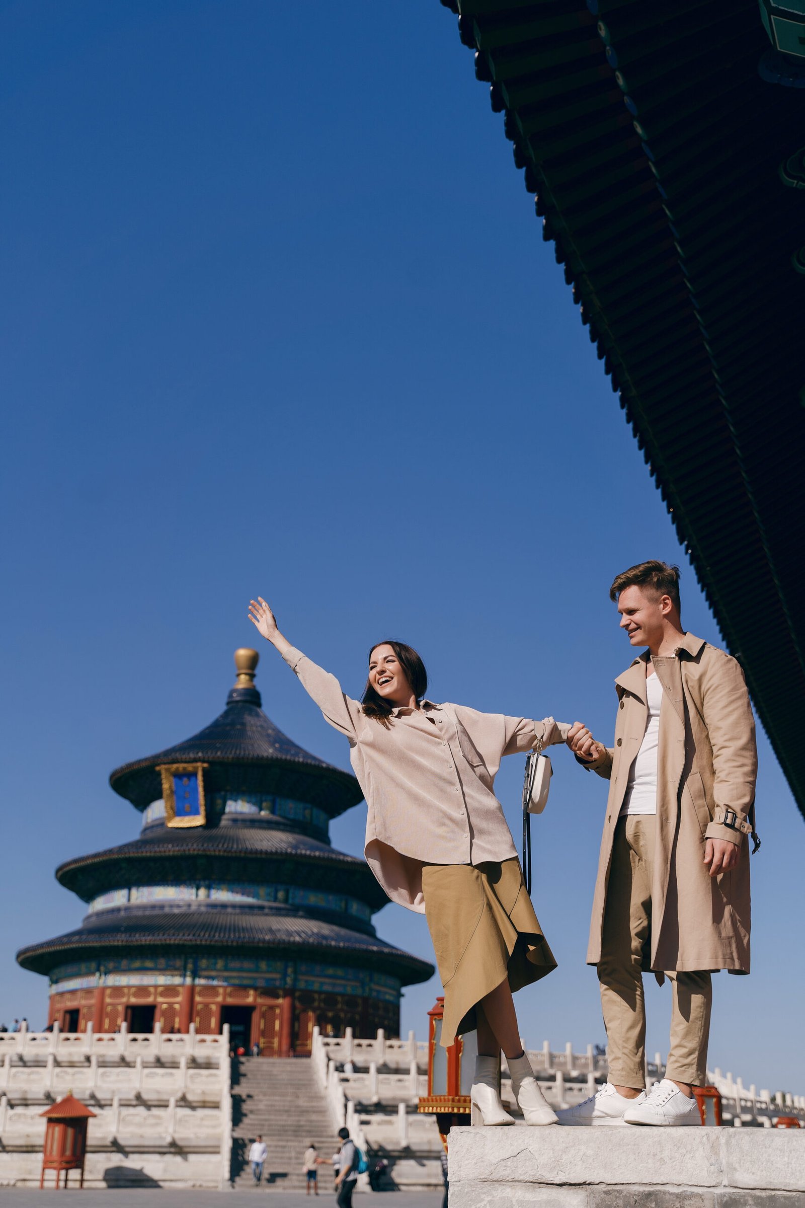 lovely couple exploring tourist attractions in Beijing China. Couple exploring temple of heaven in Beijing China. Couple experiencing chinese culture and architecture.